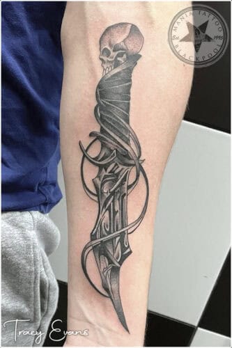 Skull knife tattoo done at Mania Tattoo Blackpool